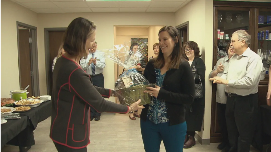 Kentville Mayor Sandra Snow gives the new nurse practitioner a welcome basket at a party held Monday night.